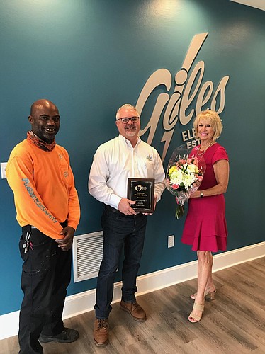  Giles Electric employee Eric Turner, Owner Brad Giles, and Food Brings Hope Executive Director Judi Winch. Courtesy photo