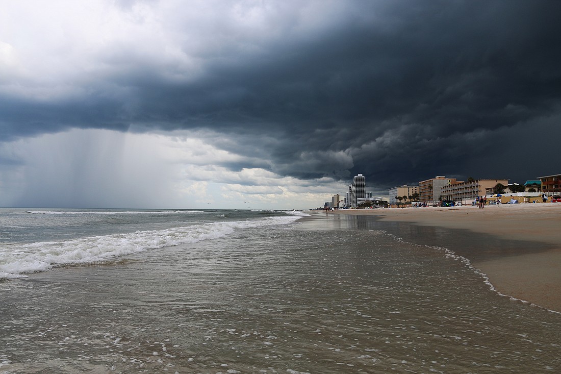 The beginning of a storm is seen rolling in from the Cardinal Drive beach approach in July 2019. File photo