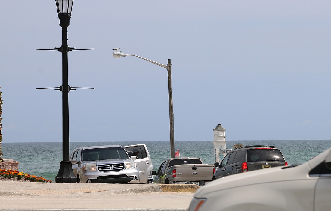 Cars entering and exiting the beach access point at Granada Boulevard. File photo