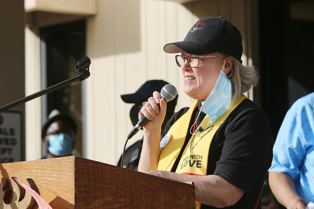 Rev. Kathy Rickey of Ormond Beach, co-chair of FAITH, speaks during a protest back in June. File photo by Jarleene Almenas