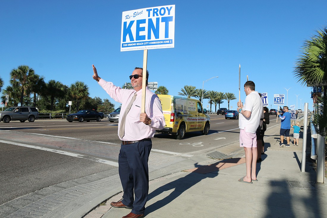 Ormond Beach City Commissioner Troy Kent campaigns on the Granada Bridge during early voting. Photo by Jarleene Almenas
