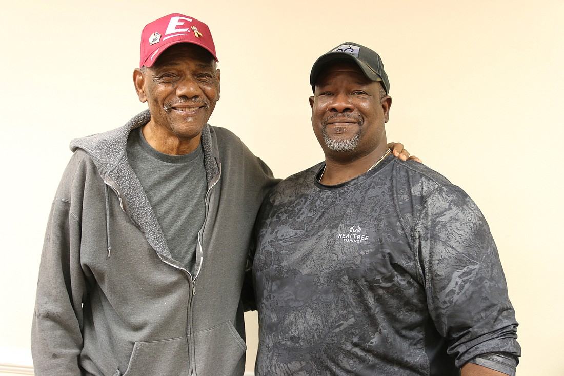 George Postell Sr. and George Postell Jr. are both proud Army veterans. Photo by Jarleene Almenas