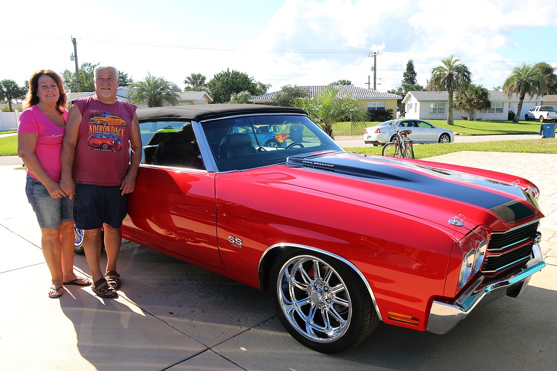 Joan and John Jensen with his 1970 Chevelle, which he restored earlier this year. Photo by Jarleene Almenas
