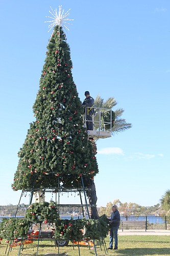 A city employee prepares the Christmas tree at Rockefeller Gardens in December 2019. File photo