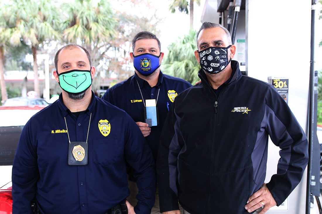 Ormond Beach Police Detective Ryan Mihalko, Sgt. Tom Larsen and Detective Ray Llanes are hoping to combat credit and debit card fraud through the use of the "Skim Reaper." Photo by Jarleene Almenas
