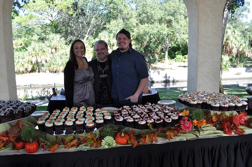 Cakes by Ron - Ron Zammitt is surrounded by son, Nathan Zammit, and Nathan's fiancee, Milan