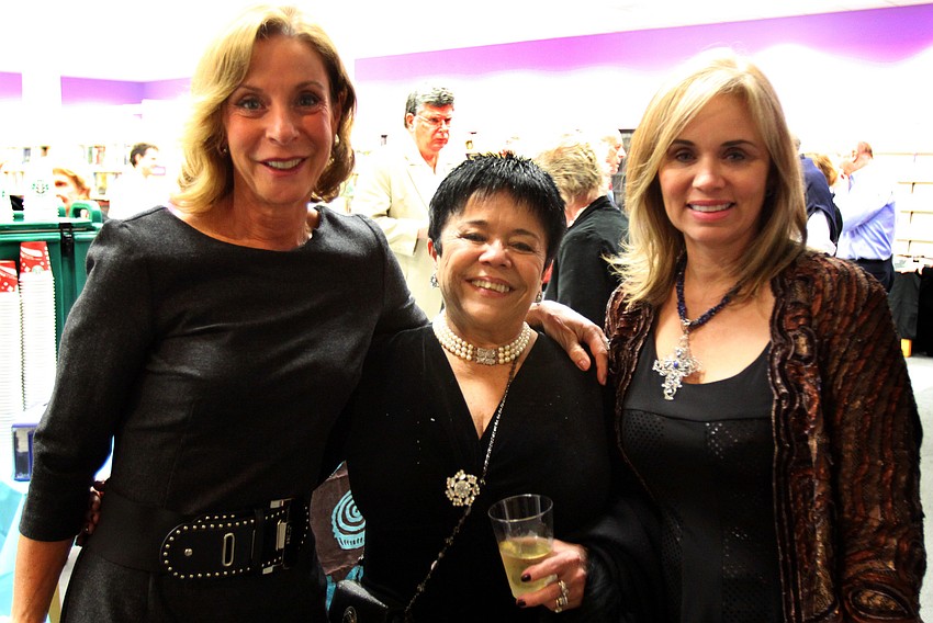 Yara Carvalho, Lais Pfitzenreiter and Artab Pangallo enjoy themselves during Looking Into the Crystal Ball, put on by Friends of the Selby Public Library, Friday night.