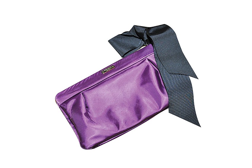 KATE SPADE CLUTCH
'A friend just gave this to me for my birthday. I love big bags for during the day but switch to clutches for going out at night.'