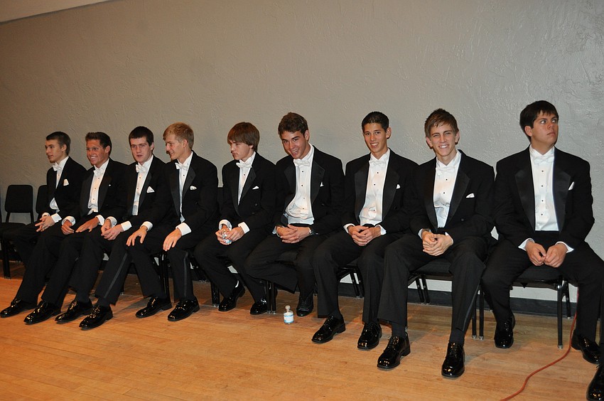 The escorts wait for the portrait