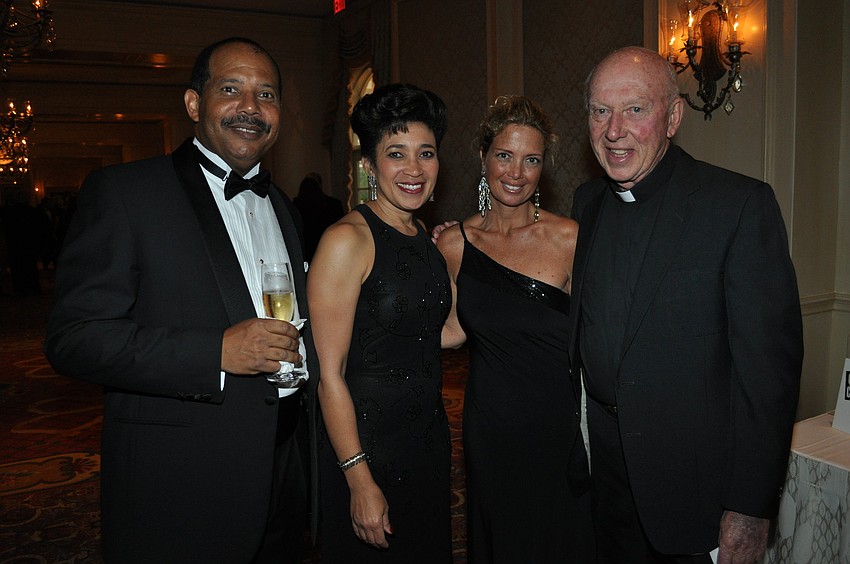 Roland and Sabrina Gibson, Bernice Hebda and Rev. John Krozser