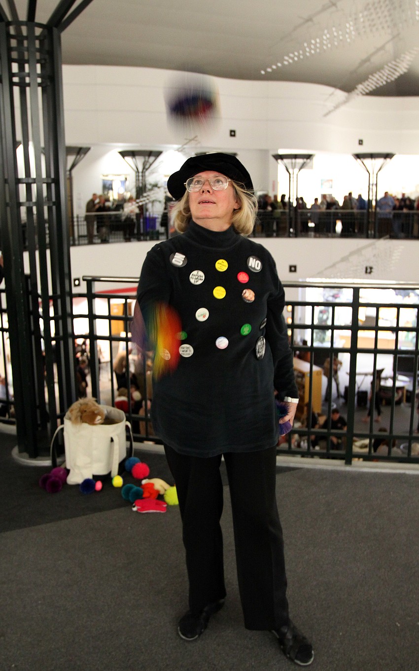Meigs Glidewell shows off her juggling skills on the second floor of the library during Looking Into the Crystal Ball.