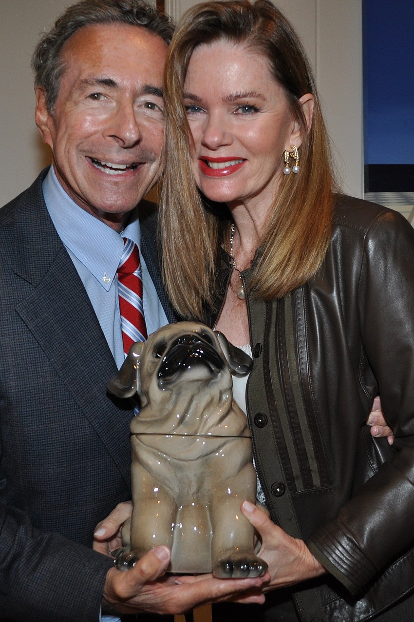 Ron and Rita Greenbaum and one of many ceramic pugs in the Kane home