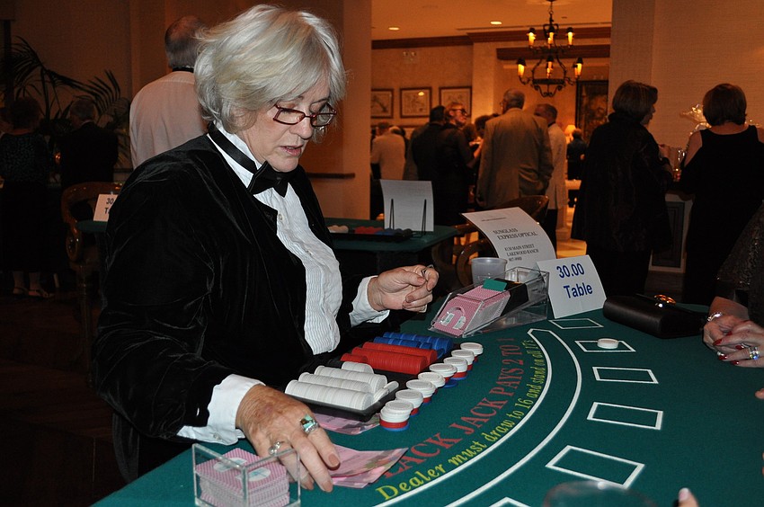 Joyce Loomis dealt at a black jack table.