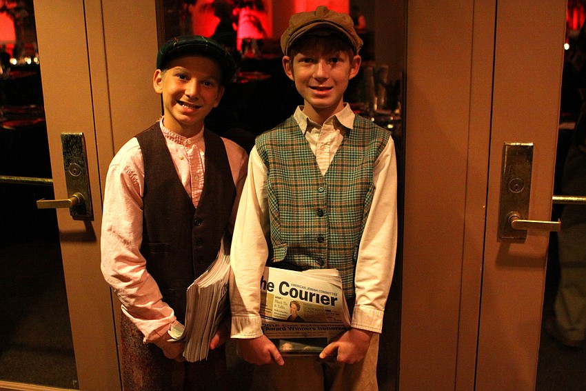 Jakob and Zachary Lutz as the AJC Courier paper boys