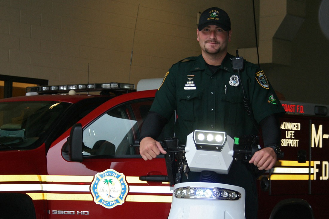 Deputy William Lowe with the T3 Motion Patroller, an emission-free electric standup vehicle he uses to patrol local bike paths.