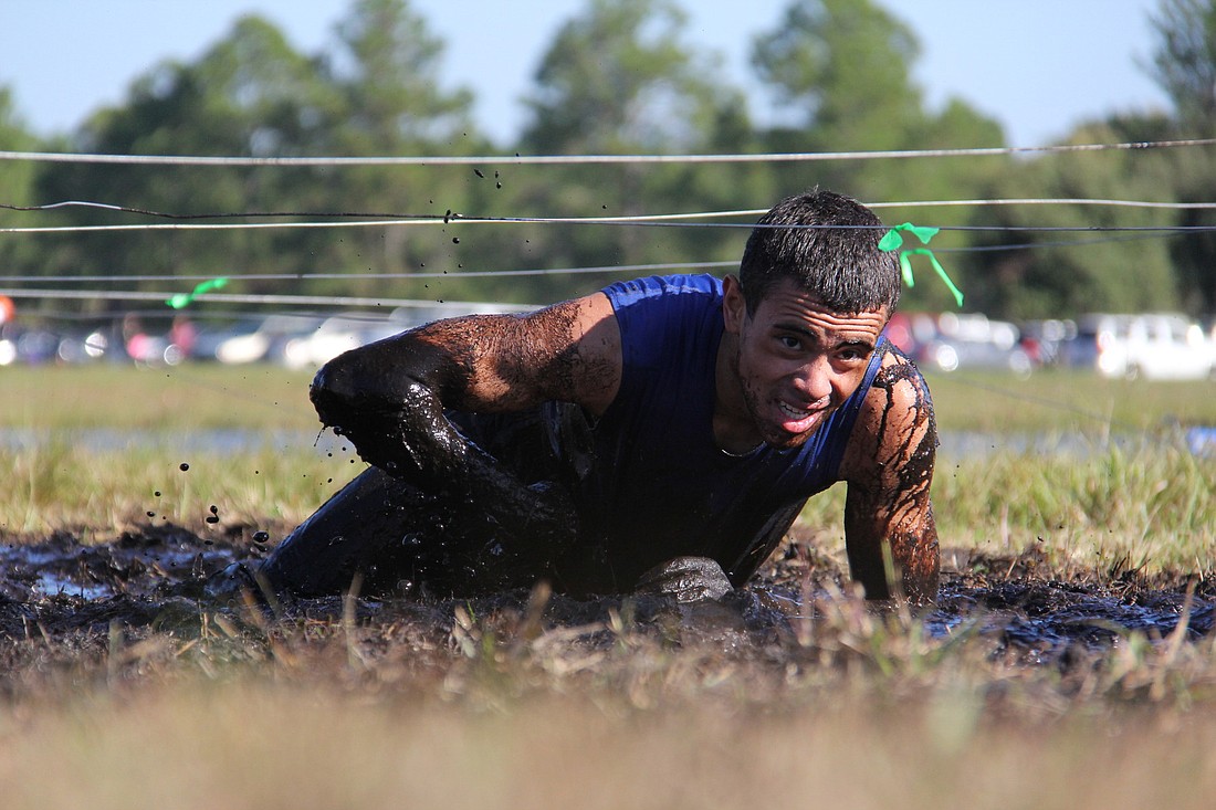 Palm Coast resident George B Rosado finished the course in 45 minutes and 19 seconds, first in his age division in the non-competitive wave. PHOTOS BY SHANNA FORTIER