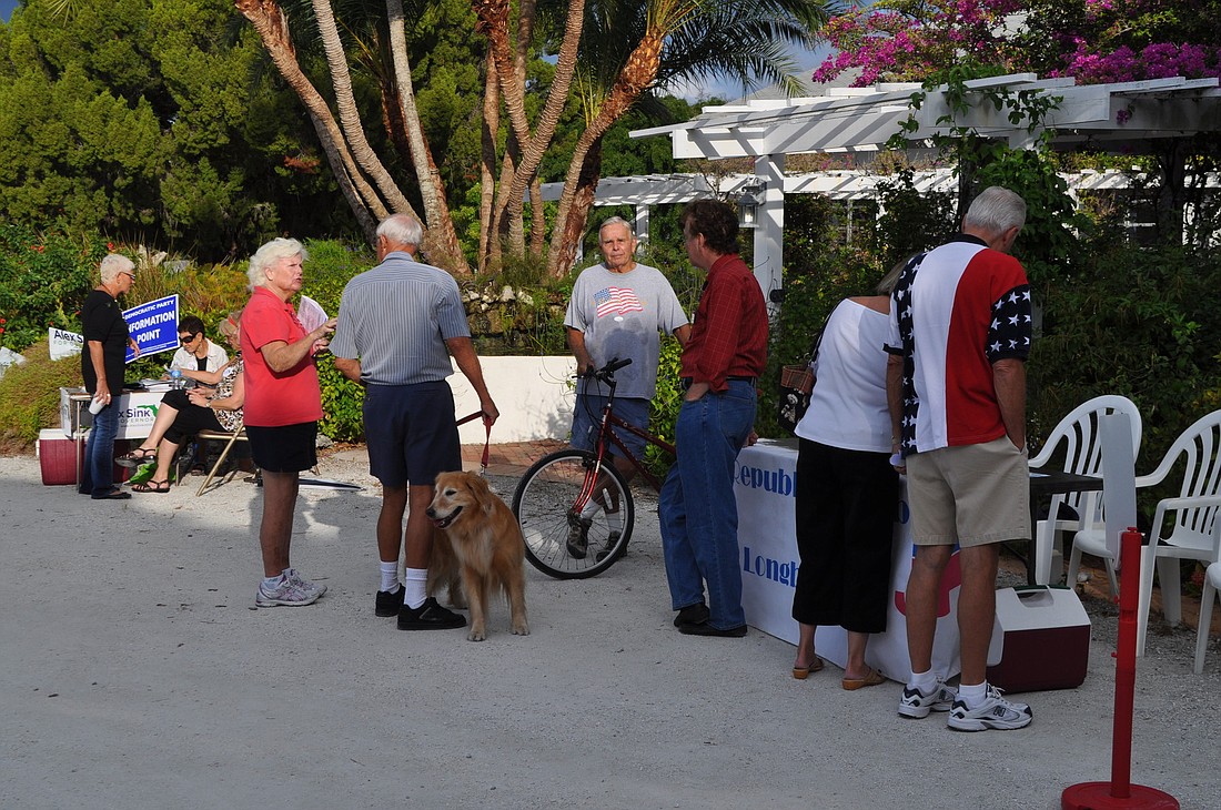 Voters head to the polls at Longboat Island Chapel before 9 a.m. Tuesday morning.