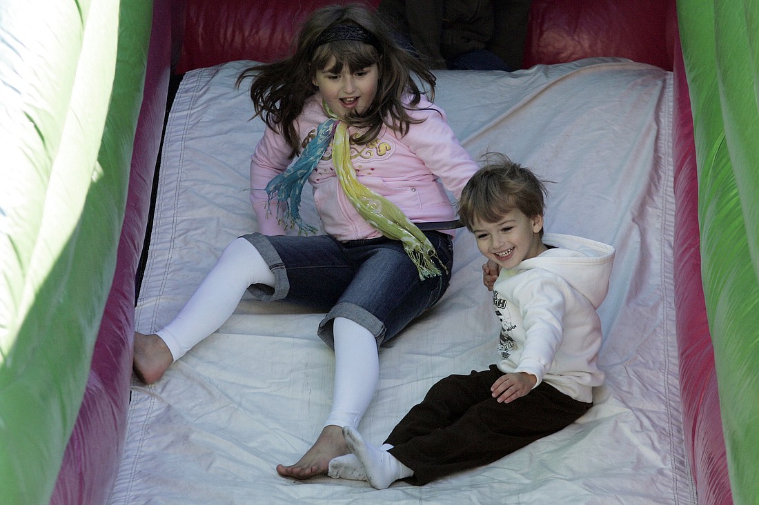 Harrison Keaser, 3, couldn't wait to slide down the slide with his older sister, Grace, 7.