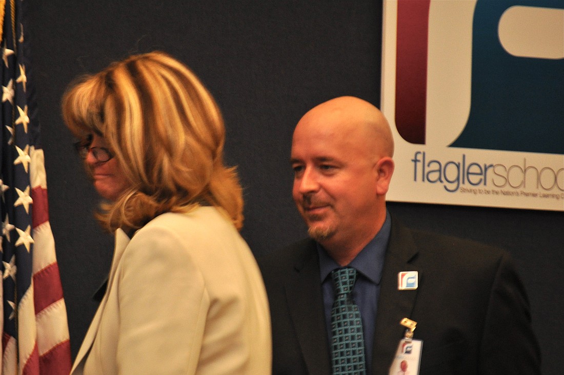 Assistant Superintendent Jacob Oliva greets Flagler County School Board members after being selected for the superintendent's position. Feb. 4. (Photo by Jonathan Simmons)