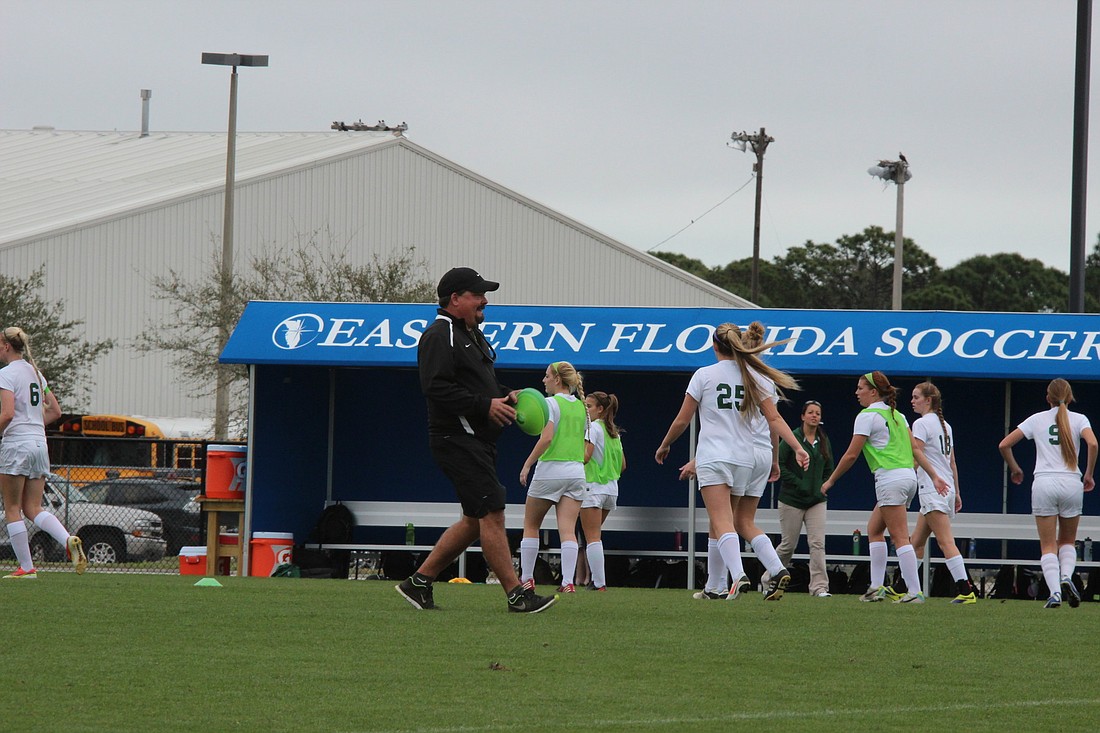 FPC coach Pete Hald sets up the warm-up grid before Friday's game vs. St. Thomas Aquinas. (Photo by Andrew O'Brien)