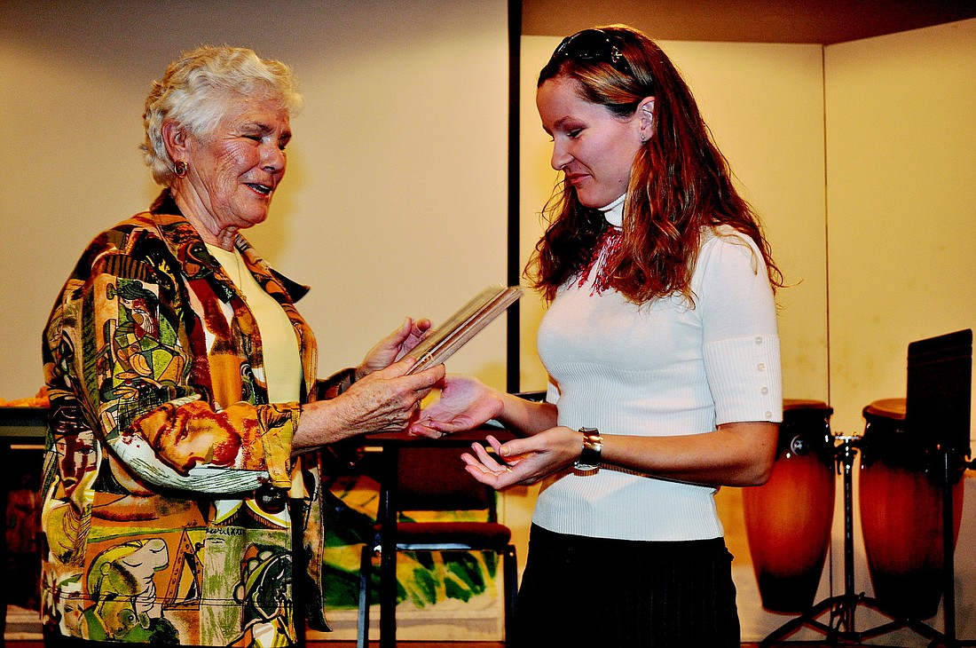 SKCC Secretary Helen Clifford awards one of the winners, Veronika Bajtalova.