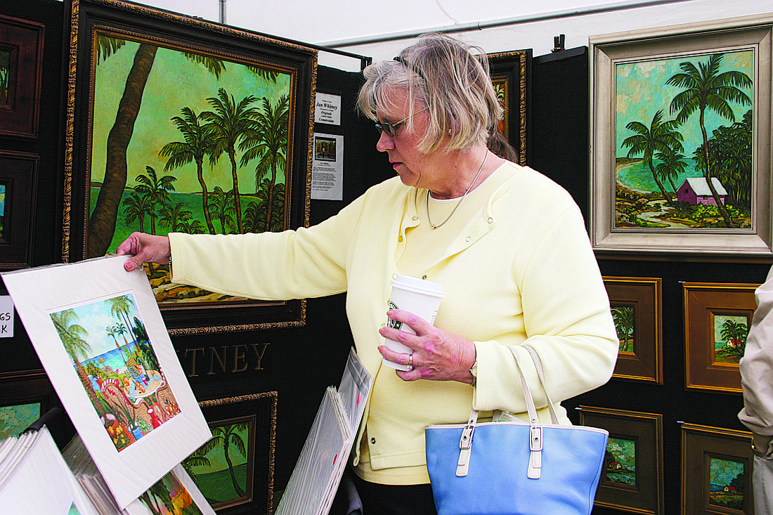 Amanda DeYoung checked out artwork at last year's St. Armands Winter Art Festival.