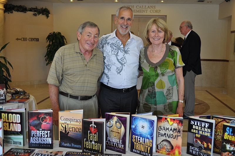 Oceanview Publishing Manager Frank Troncale, center, with co-owners/authors Robert and Patricia Gussin