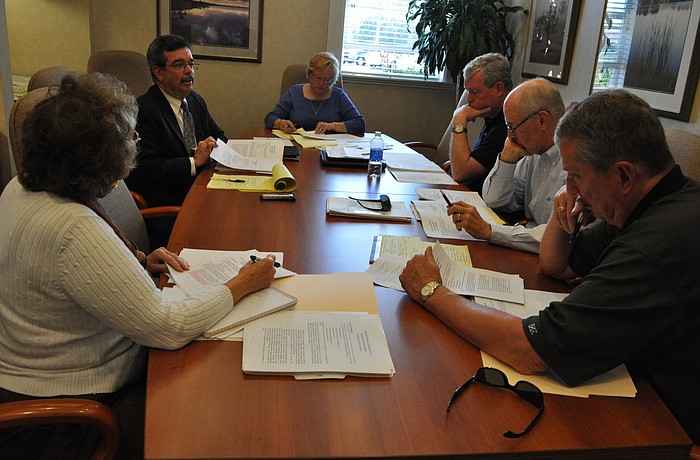 Town Hall Executive Director Bob Fernandez, back left, shared with members of the Inter-Disrict Authority board about his experience in his post during a meeting Jan. 27.