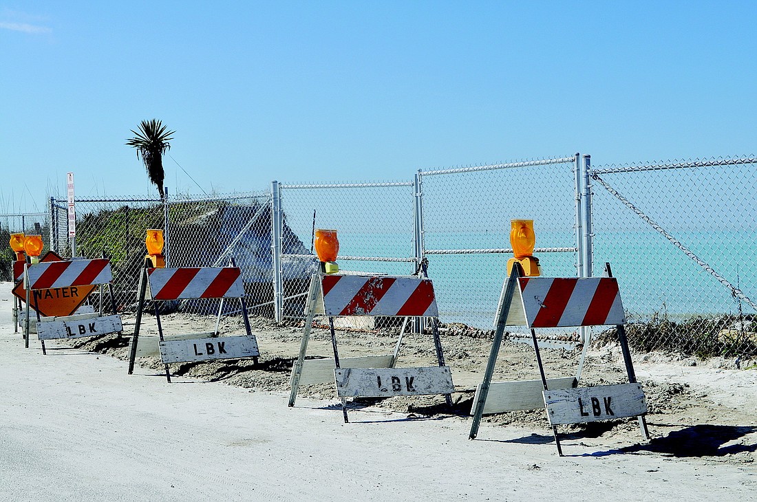 Town employees had to place beach-quality material near North Shore Road Jan. 23 to keep the road from washing out.
