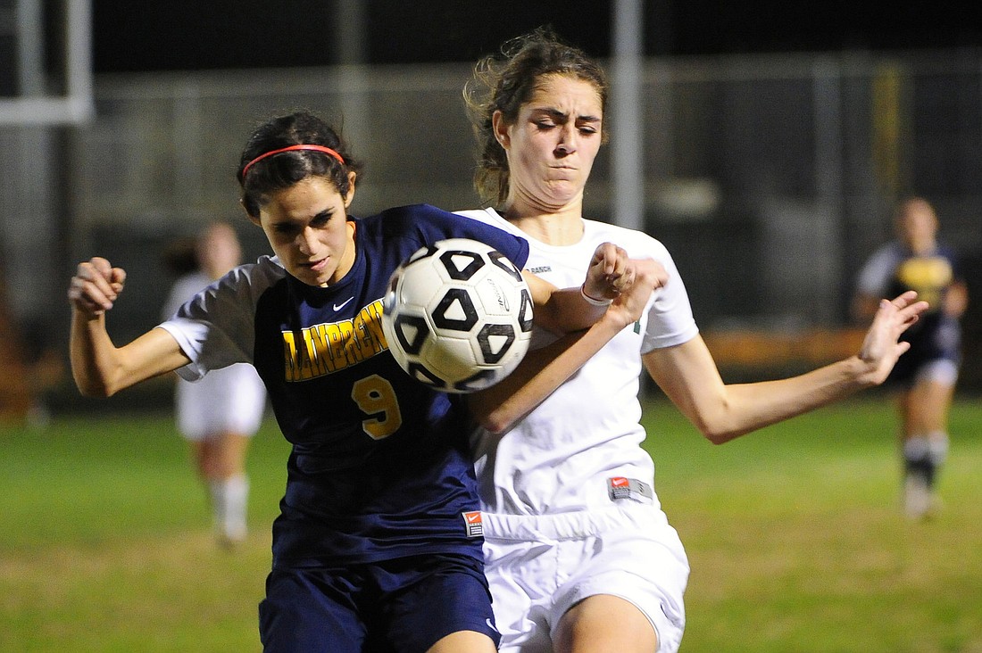 Lakewood Ranch's Kaitlyn Wolfe battles a George Steinbrenner defender for the ball during a regional semifinal match Feb. 1.