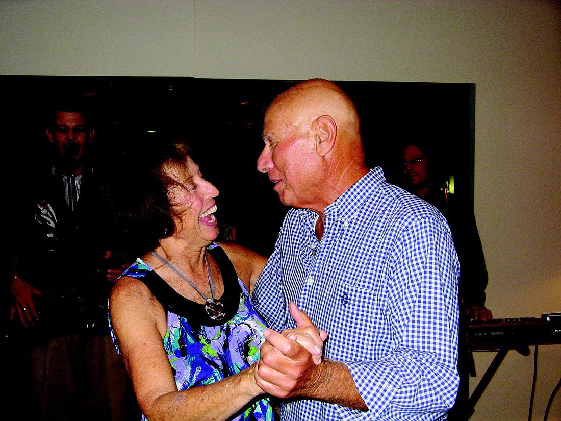Fran Harris and Al Tripodi dance together at a Thanksgiving celebration, at which he says they made their relationship "semi-official."