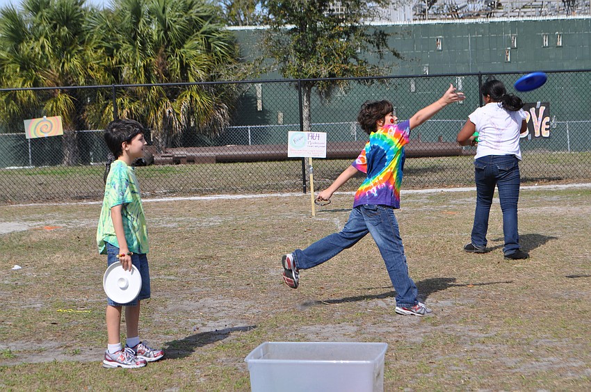 Harry Echtman and Seth Morton play a game of frisbee.