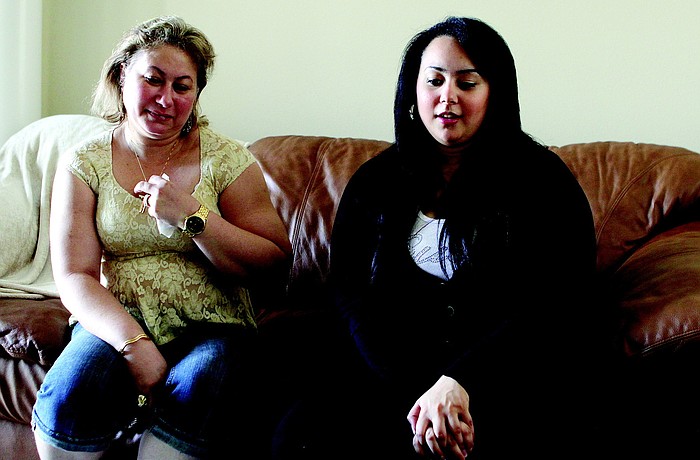 Listening to her daughter, Aan Iskandar, right, relay her feelings about the situation in Egypt, Eman Elnaggar is thankful to have her husband and two children under one roof.