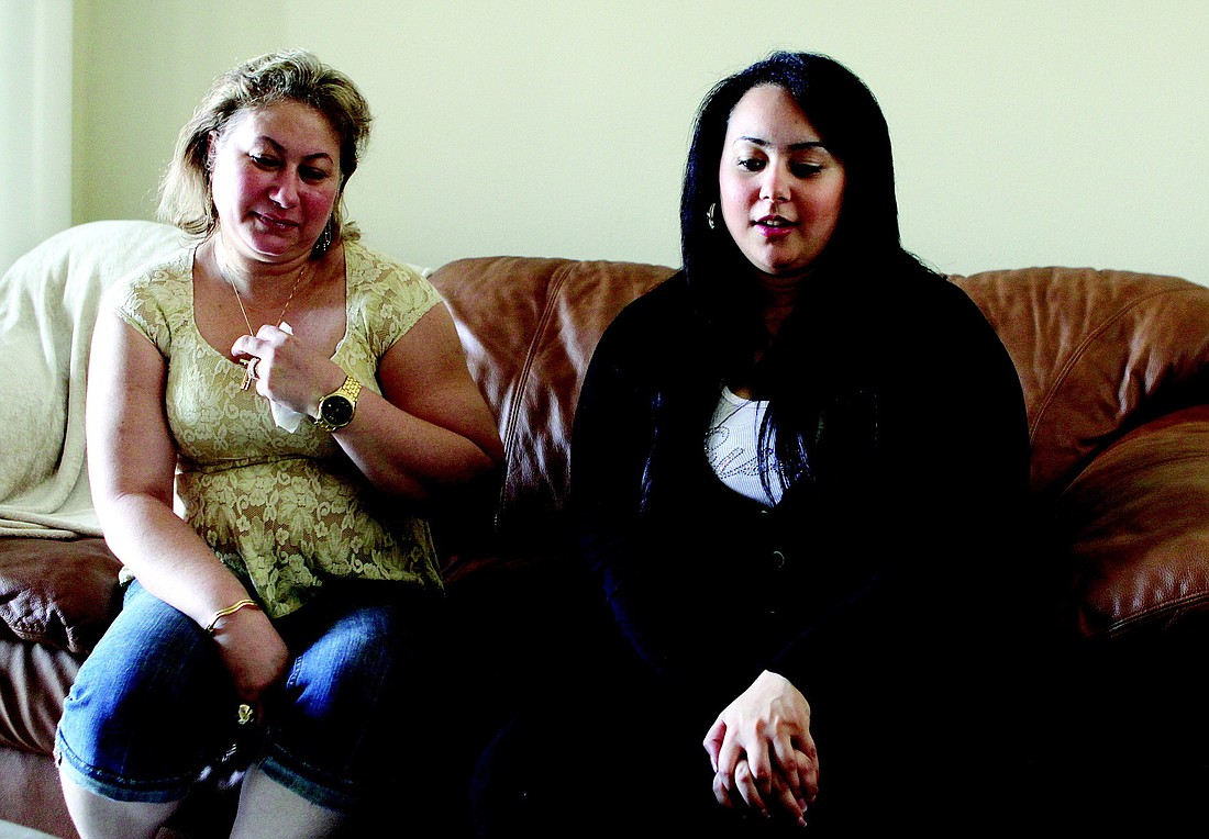 Listening to her daughter, Aan Iskandar, right, relay her feelings about the situation in Egypt, Eman Elnaggar is thankful to have her husband and two children under one roof.