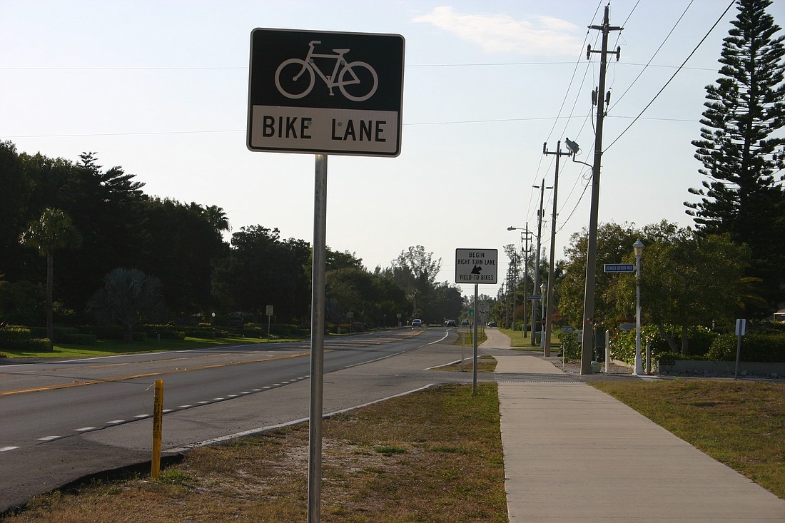 Bicyclists are upset that the Florida Department of Transportation is willing to remove some of these signs along Gulf of Mexico Drive.