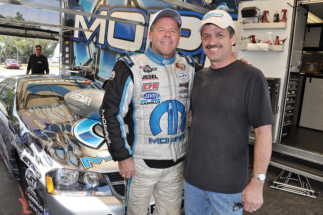 Pro Stock driver Allen Johnson took time to educate local firefighters, including East Manatee Fire Rescue Training Officer Tim Hyden, about safety features on racing vehicles while he was at the Bradenton Motorsports Park for winter testing last week.