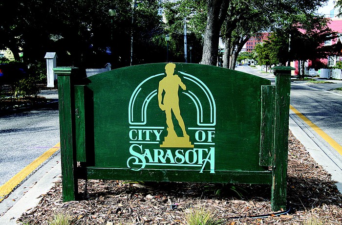 The back of the Laurel Park neighborhood sign has the city's logo painted on it. City rules call for just one side of the sign to be decorated.