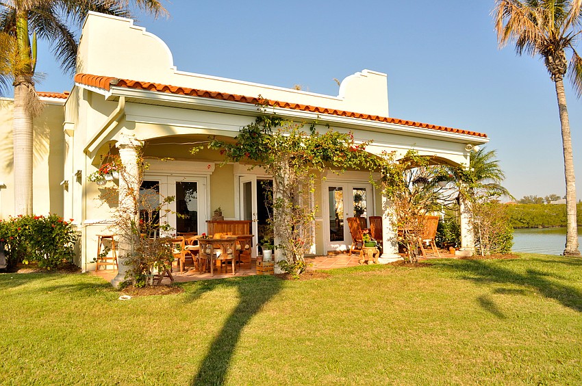 Treasures from Around the World: This Casey Key home features 285 feet of bay.
