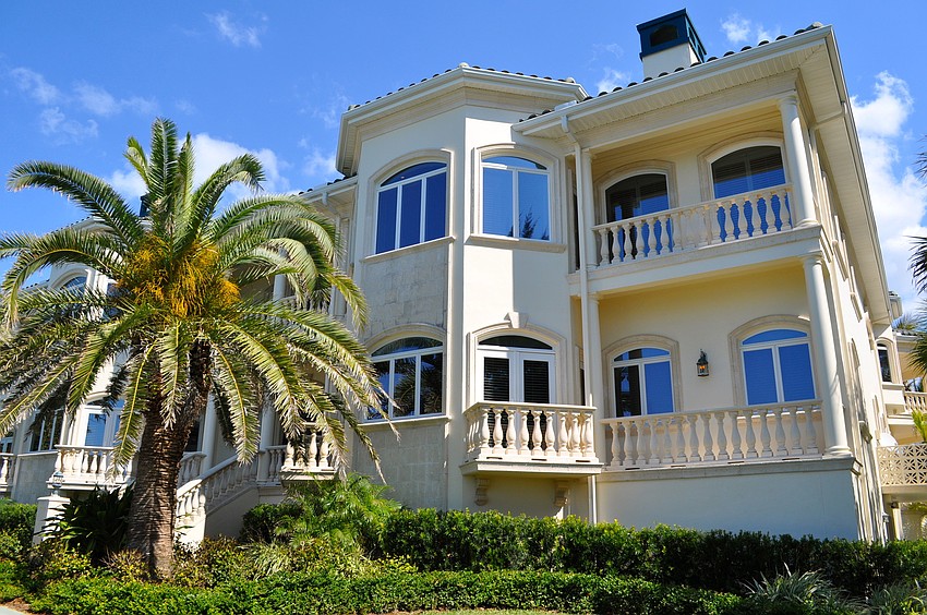 Magical Beachfront Mansion: This eight-bedroom Casey Key estate boasts 16,000 square-feet of refined living space.