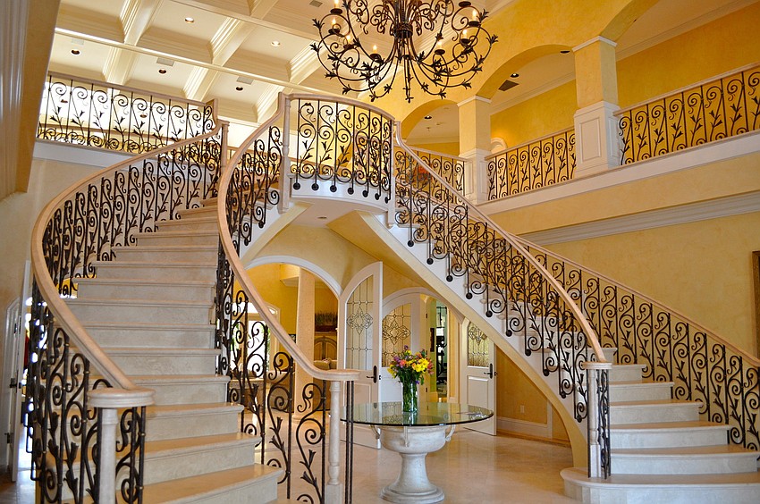 Magical Beachfront Mansion: The iron staircase makes for a grand entrance.