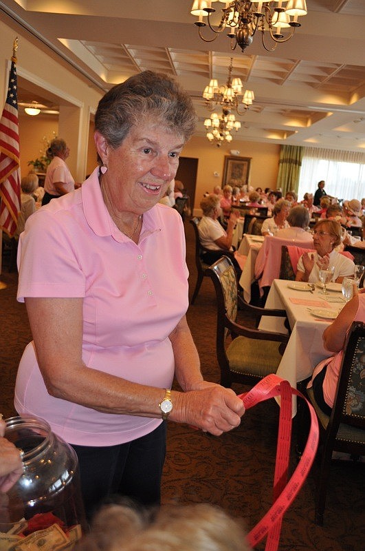 Donna Coyne helped distribute raffle tickets.