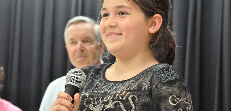 Student Council member Isabelle Chamness told students about an upcoming fundraiser for Southeastern Guide Dogs.