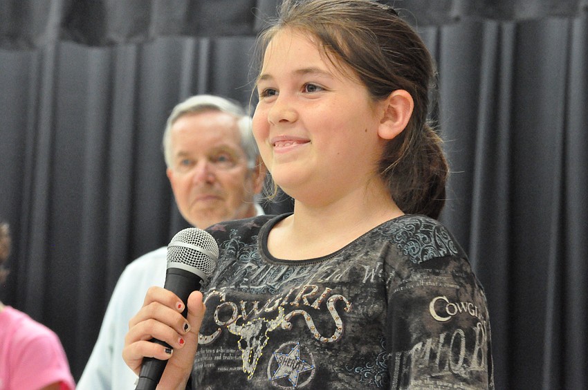 Student Council member Isabelle Chamness told students about an upcoming fundraiser for Southeastern Guide Dogs.