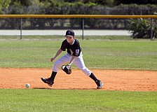 Bryan Wacha, 10, hussles to get to a ground ball during his game on Saturday, Feb. 19 at Twin Lakes Park during Central Sarasota Little League Opening Day.