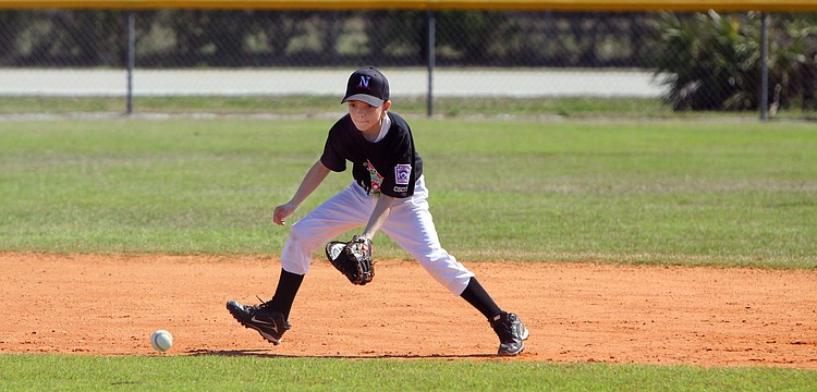Bryan Wacha, 10, hussles to get to a ground ball during his game on Saturday, Feb. 19 at Twin Lakes Park during Central Sarasota Little League Opening Day.