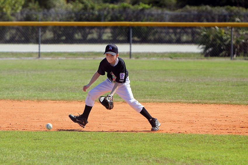 Bryan Wacha, 10, hussles to get to a ground ball during his game on Saturday, Feb. 19 at Twin Lakes Park during Central Sarasota Little League Opening Day.