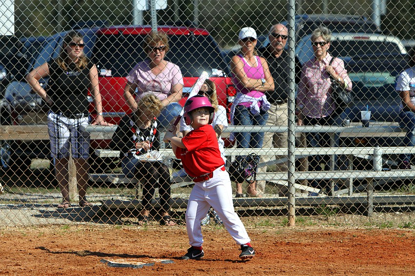 Jada Totten, 6, gets ready to swing during her game on Saturday, Feb. 19 at Twin Lakes Park during Central Sarasota Little League Opening Day.