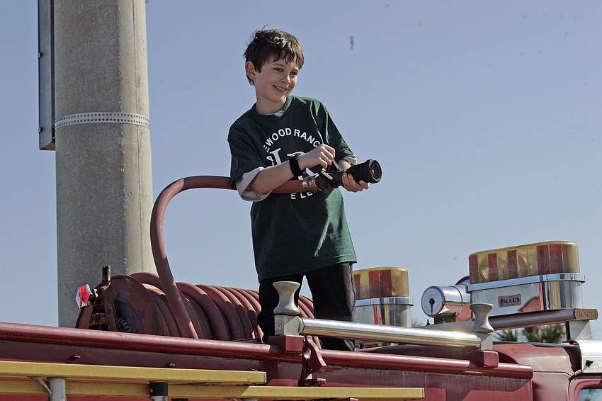 Gene Witt Elementary first-grader Drew Clark had a blast playing on the fire truck.