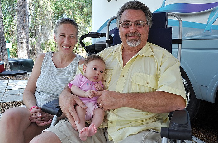 "It's been in our garage for about 25 years," said Doug Williams of the refrigerator, pictured with his wife, Laura, and 3-month-old daughter Melissa.