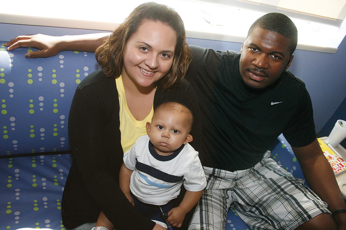 Ivette and Anthony Littlejohn surround their son, Adrian, with positive energy as he undergoes chemotherapy.